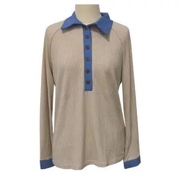 Beige blouse with blue accents on a mannequin against a white background