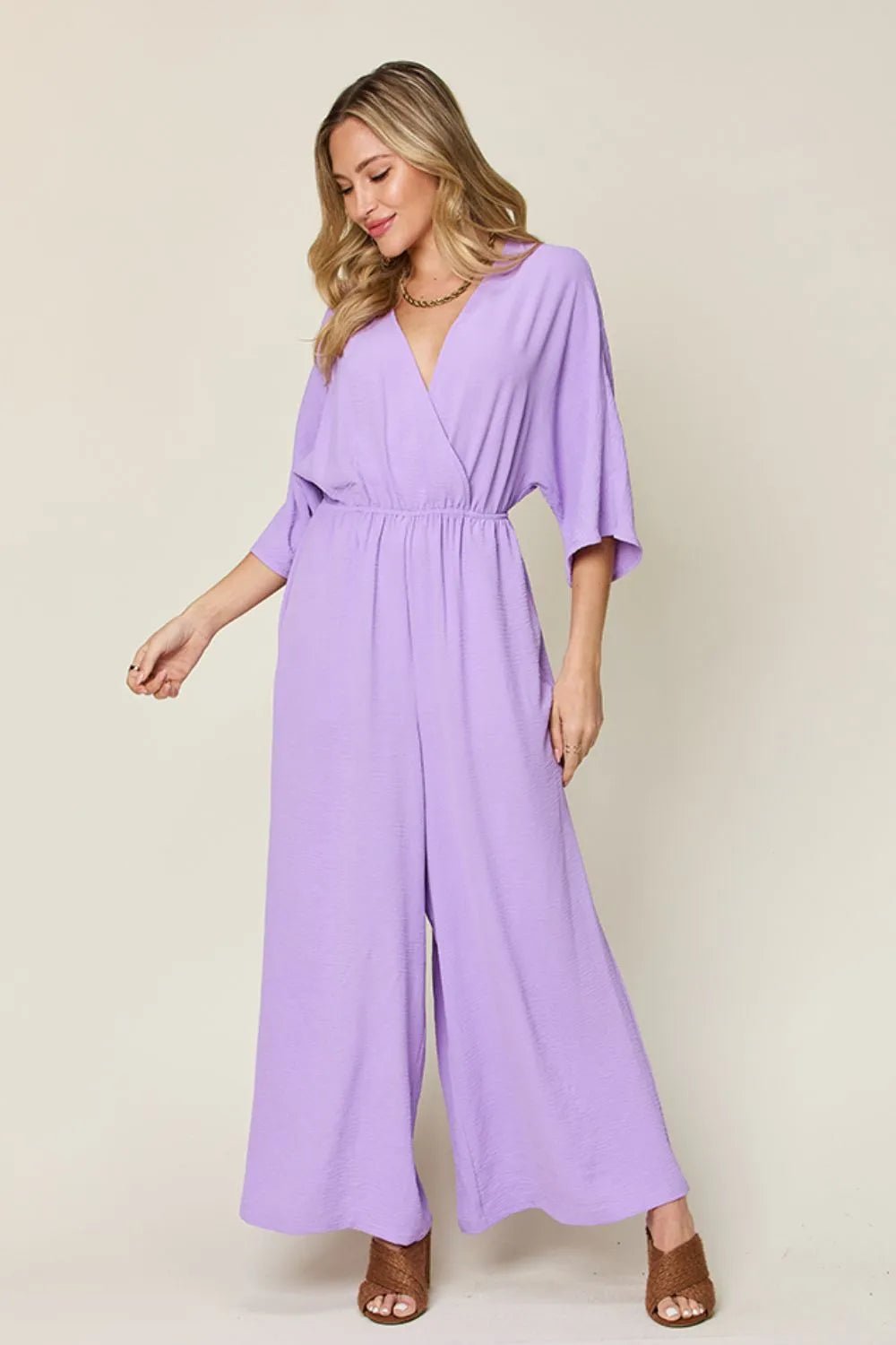 Double Take Full Size Surplice Wide Leg Jumpsuit with Pockets | Nikki &amp; Co. Boutique