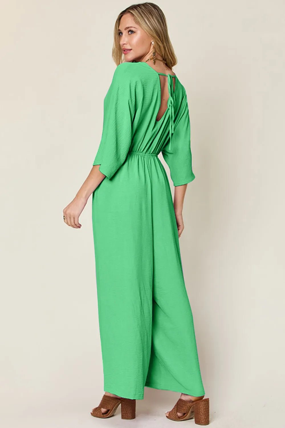 Double Take Full Size Surplice Wide Leg Jumpsuit with Pockets | Nikki &amp; Co. Boutique