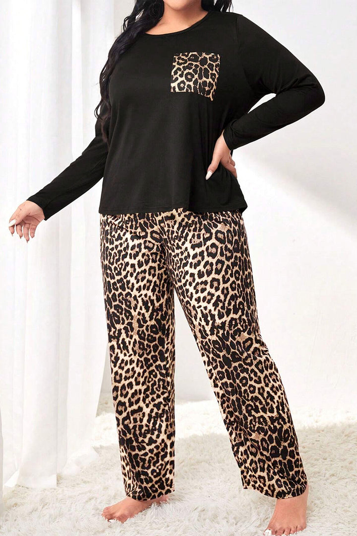 Person wearing a black top with leopard print pocket and leopard print pants on a white background