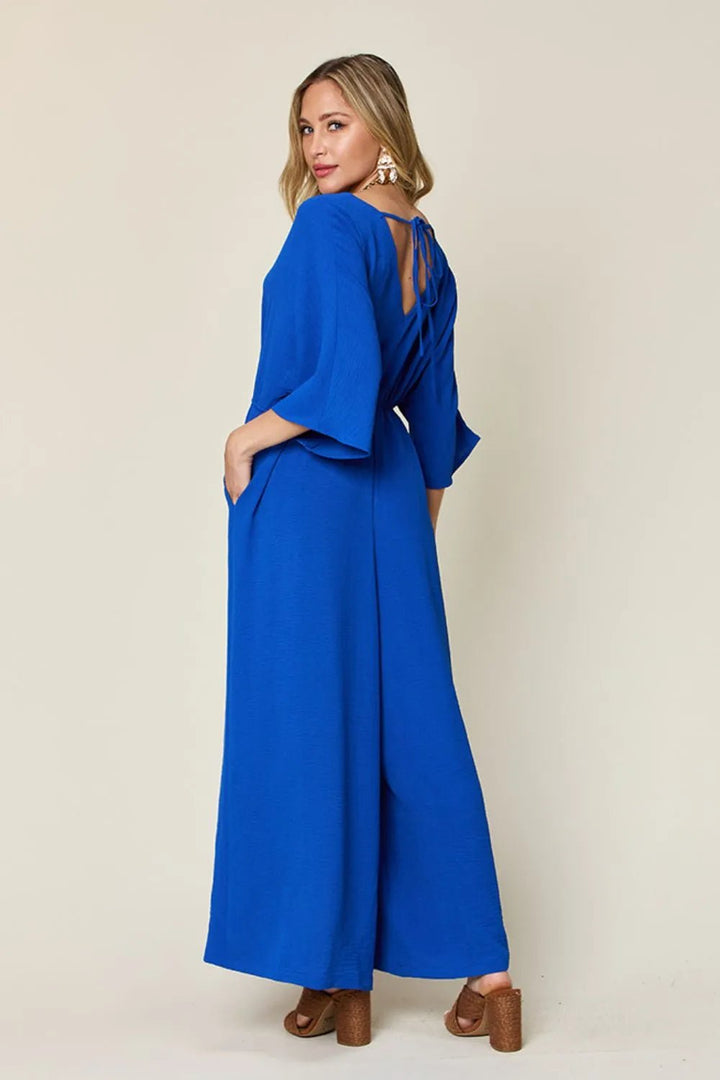 Double Take Full Size Surplice Wide Leg Jumpsuit with Pockets | Nikki &amp; Co. Boutique