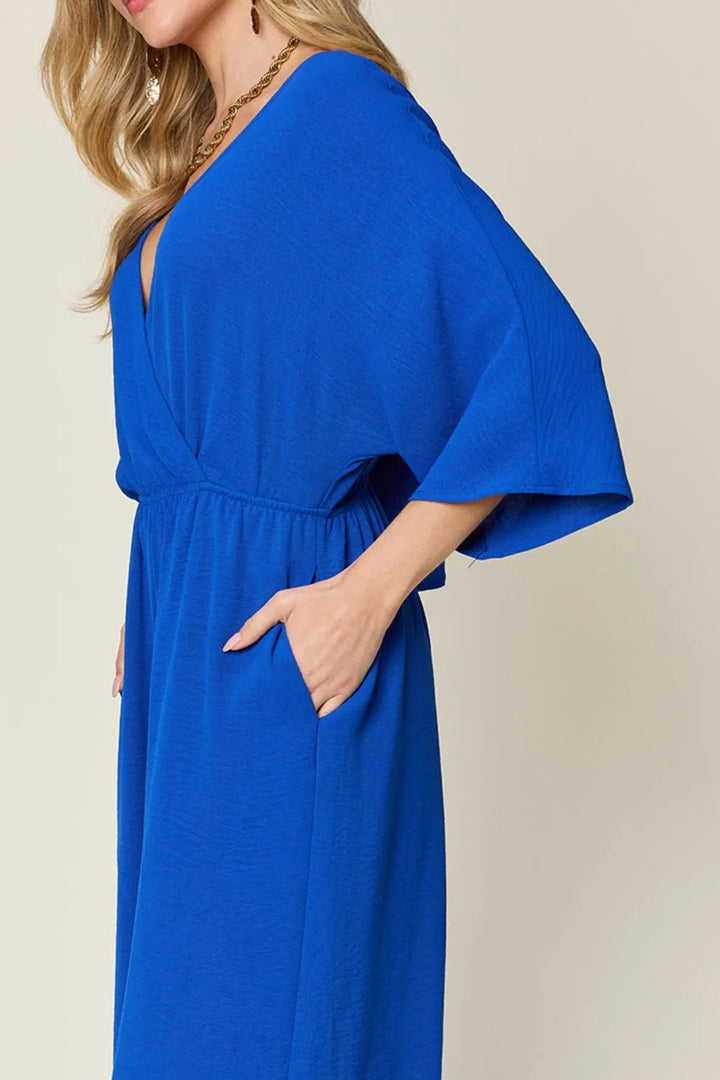 Double Take Full Size Surplice Wide Leg Jumpsuit with Pockets | Nikki &amp; Co. Boutique
