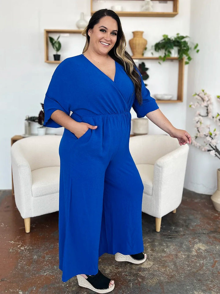 Double Take Full Size Surplice Wide Leg Jumpsuit with Pockets | Nikki &amp; Co. Boutique