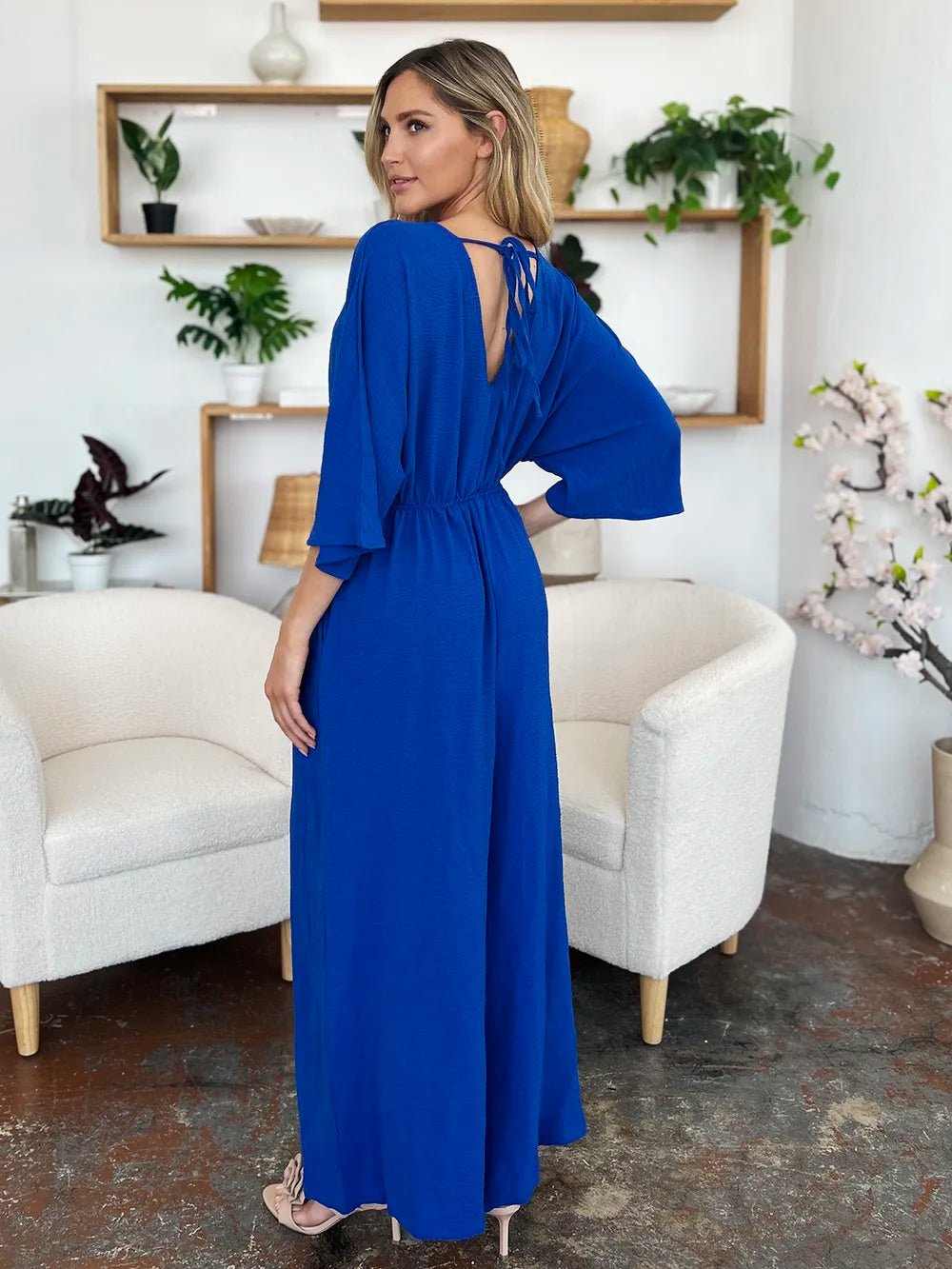 Double Take Full Size Surplice Wide Leg Jumpsuit with Pockets | Nikki &amp; Co. Boutique