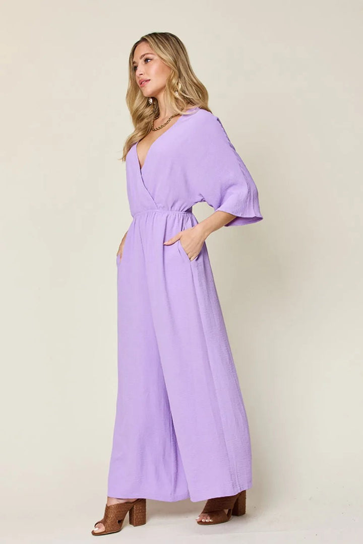 Double Take Full Size Surplice Wide Leg Jumpsuit with Pockets | Nikki &amp; Co. Boutique
