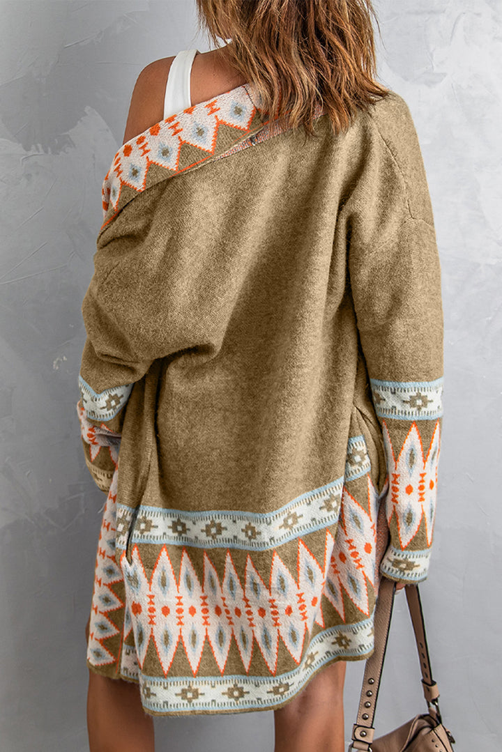Person wearing a patterned sweater with a plain background