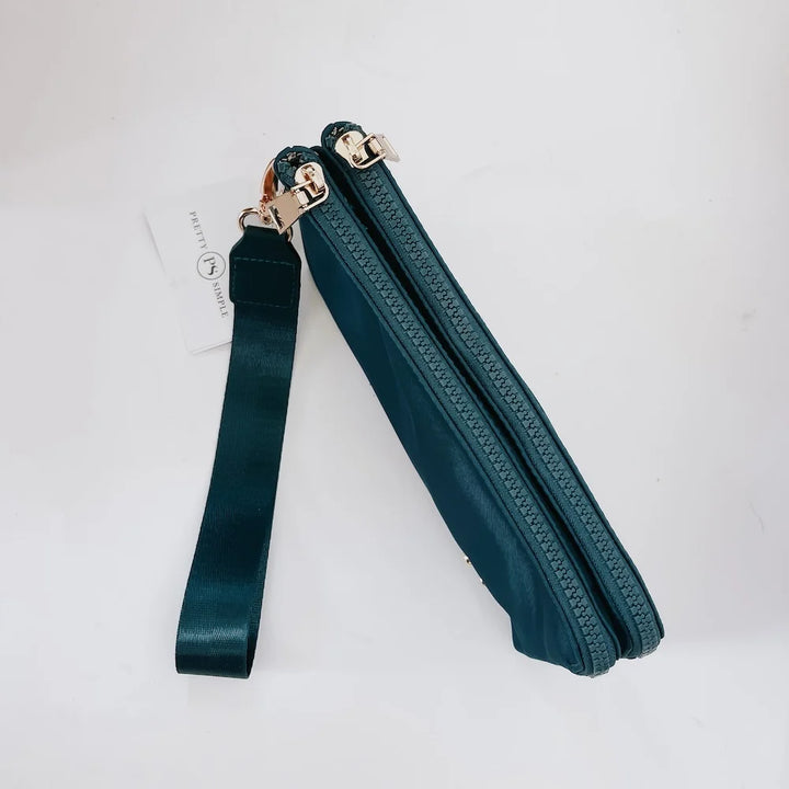 Teal wristlet zippered closed