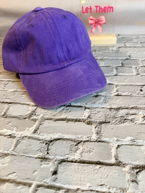 Purple cap on a textured brick wall with text overlay
