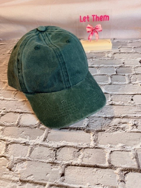 Green cap on a brick wall with text 'Let Them' above.