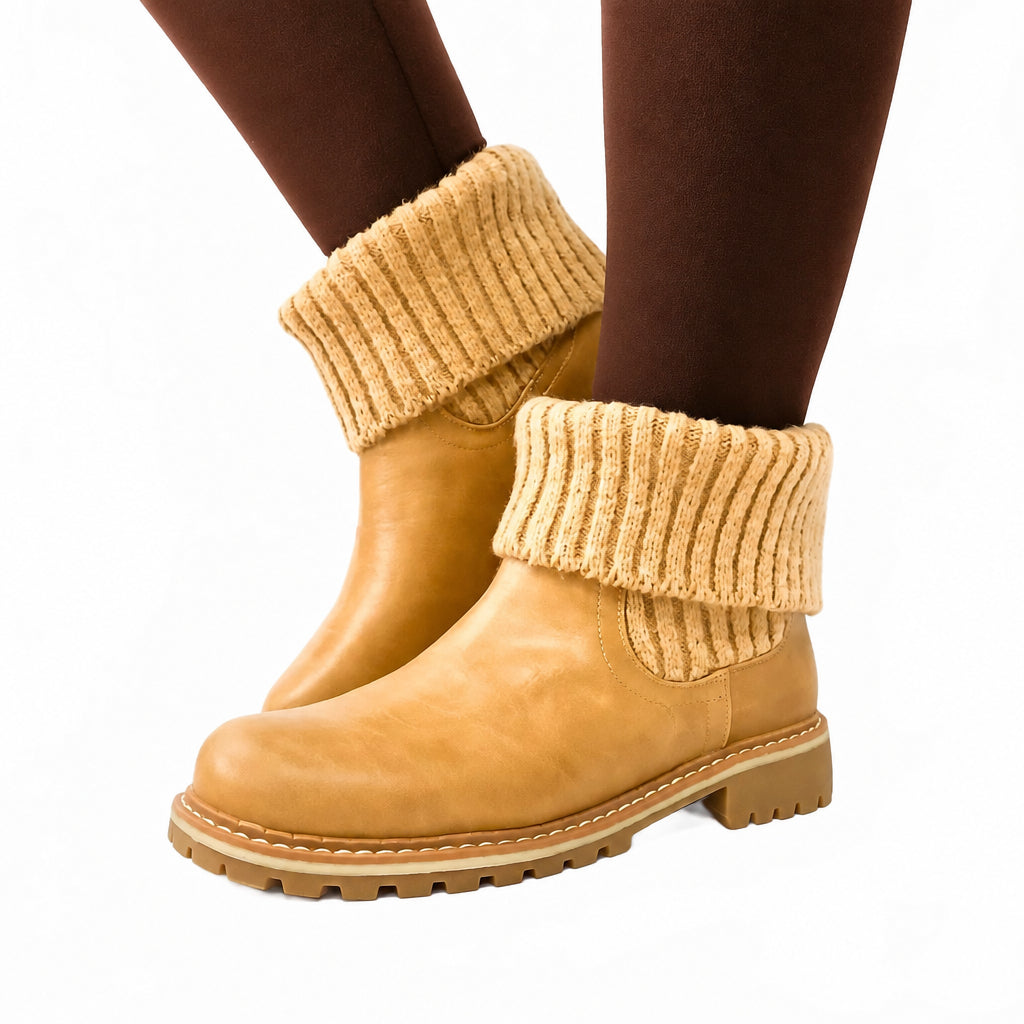 Tan boots with knit leg warmers worn by a person on a white background