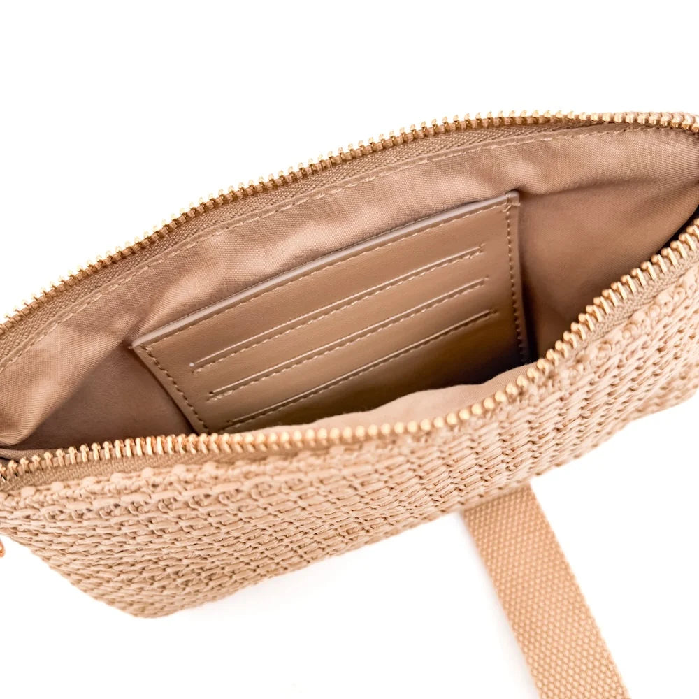 Beige wristlet wallet opened to show internal compartment